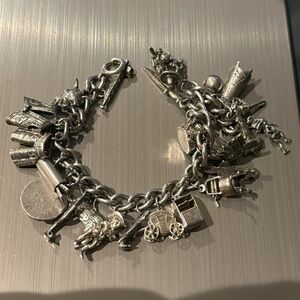 Vintage Superb 24 solid silver charms on solid silver bracelet weighs 61g 1970